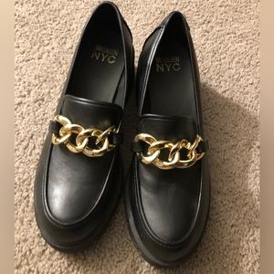 Black and gold Steve Madden NYC platform shoes